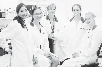  ?? CHRIS YOUNG
THE CANADIAN PRESS ?? Jane Batt, centre, scientist at St. Michael's Keenan Research Centre for Biomedical Science, is joined by students who took part in the space flight experiment­s program: Kay Wu, left, Alice Vlasov, Amy Freeman and Annabel Gravely at St. Michael's...