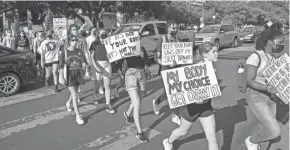  ?? JAY JANNER/AMERICAN-STATESMAN ?? More than 100 University of Texas students march from the campus to the Capitol on Sept. 7 to protest a law banning abortions after about six weeks.