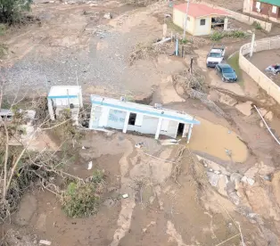  ?? AP ?? A house lays in the mud after it was washed away by Hurricane Fiona at Villa Esperanza in Salinas, Puerto Rico, on Wednesday, September 21. Fiona left hundreds of people stranded across the island after smashing roads and bridges, with authoritie­s still struggling to reach them four days after the storm smacked the U.S. territory, causing historic flooding. (AP Photo/alejandro Granadillo)