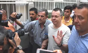  ??  ?? Brunson reacts as he arrives at his home after being released from the prison in Izmir, Turkey. — Reuters photo