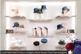  ??  ?? A wall dedicated to hats, a category Maria Grazia Chiuri has energized.