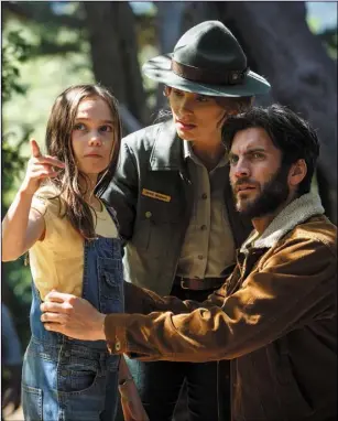  ??  ?? Bryce Dallas Howard as Grace, Wes Bentley as Jack and Oona Laurence as Natalie in Pete’s Dragon.