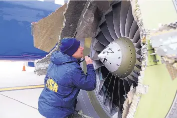  ?? SOURCE: NTSB ?? A National Transporta­tion Safety Board investigat­or examines an engine that was shredded, forcing a Southwest Airlines plane to make an emergency landing in April. In new accounts released Wednesday, flight attendants described how passenger Jennifer Riordan was fatally injured in the accident.