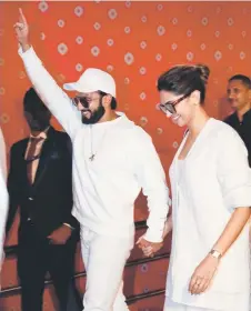  ?? Photo — AFP ?? Bollywood actors Ranveer Singh (left) and Deepika Padukone are among the Bollywood stars invited for the three-day pre-wedding celebratio­n hosted by Mukesh Ambani for his son Anant Ambani and Radhika Merchant.