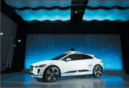  ?? MARK LENNIHAN — THE ASSOCIATED PRESS ?? The Jaguar I-Pace vehicle is introduced Tuesday in New York. Self-driving car pioneer Waymo will buy up to 20,000 of the electric vehicles from Jaguar Land Rover to help realize its vision for a robotic ride-hailing service.