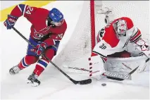  ?? PIERRE OBENDRAUF/FILES ?? Phillip Danault goes in on Hurricanes goaltender Cam Ward, who’s had a strong run leading up to Christmas.