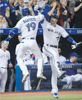  ?? NATHAN DENETTE/THE CANADIAN PRESS FILE ?? Toronto Blue Jays right-fielder Jose Bautista has another bash brother this season in teammate Justin Smoak, who is leading the Jays in home runs and RBIs.