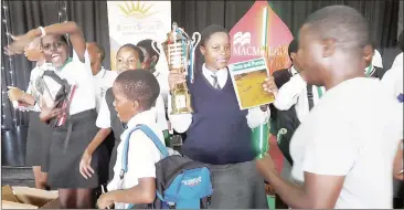  ?? ?? Learners celebratin­g and showing off the prizes they won.