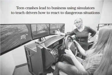  ??  ?? Maggie Shelton explains to Brittney Esser, 16, what she needs to look for after hitting an animal crossing the road while driving in a simulator.