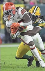  ?? MARK HOFFMAN / MJS ?? Packers inside linebacker De'Vondre Campbell stops Browns running back D'Ernest Johnson during a game last December.
