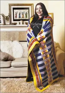  ?? Mel Melcon Los Angeles Times ?? BETHANY YELLOWTAIL, a Crow and Northern Cheyenne fashion designer, is wrapped in her “All My Relations” blanket.