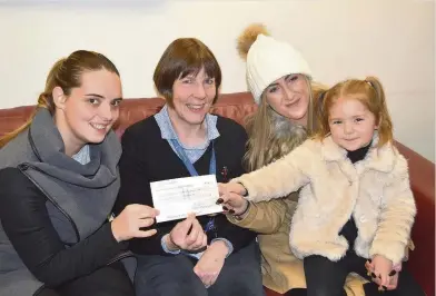  ??  ?? Cash boost Bereavemen­t adviser Susan Milne (second left) receives the cheque from (left) Cherie Lowe, Gemmalee Clark and Chanelle Clark