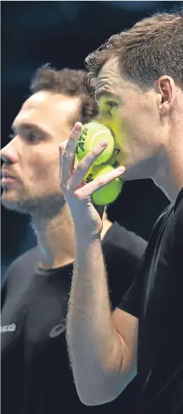  ?? Picture: Getty Images. ?? Jamie Murray, right, talks tactics with playing partner Bruno Soares as they cruise to victory.