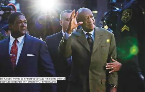  ?? Photo by AP ?? Bill Cosby waves to cheering fans as he leaves after a court appearance in Norristown, Pennsylvan­ia.