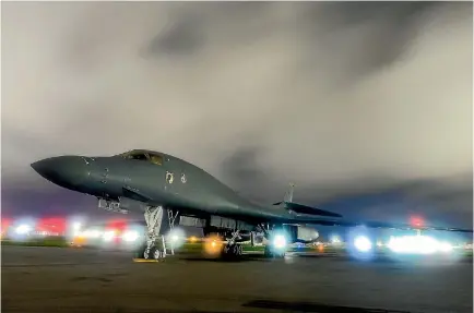  ?? PHOTOS: REUTERS ?? A US Air Force B-1B Lancer bomber sits on the runway at Anderson Air Force Base in Guam, which has been identified by North Korea as a possible target for its new long-range interconti­nental ballistic missile. The B-1s conducted drills with Japan’s air...