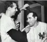  ??  ?? Phil Linz, left, celebrates with manager Yogi Berra after the Yankees clinched the American League pennant in 1964.