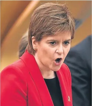  ?? Picture: Getty. ?? Nicola Sturgeon answers back during FMQs.