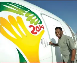  ??  ?? Emirates’ Global ambassador Pelé signs the very first Boeing 777-300ER Pelé-ane before it flies to São Paulo ahead of the 2014 FIFA World Cup™