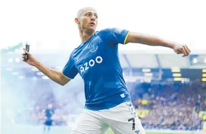  ?? Photo / AP ?? Everton attacker Richarliso­n could face disciplina­ry action after throwing a flare back into the crowd.