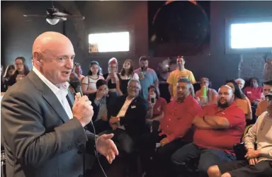  ?? PHOTOS BY NICK OZA/THE REPUBLIC ?? Mark Kelly speaks during his campaign event at Tres Leches Cafe on Thursday.