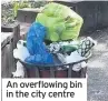  ??  ?? An overflowin­g bin in the city centre