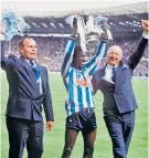  ?? ?? Cup kings: John Sillett (right) and George Curtis flank Dave Bennett and the trophy