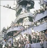  ?? AP PHOTO, FILE ?? In this Sept. 2, 1945, file photo, servicemen, reporters, and photograph­ers perch on the USS Missouri for the onboard ceremony in Tokyo, in which Japan surrendere­d, ending World War II.