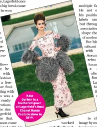  ??  ?? KaiaGerber in a feathered gown at Lagerfeld’s final Chanel Haute Couture show in 2019.