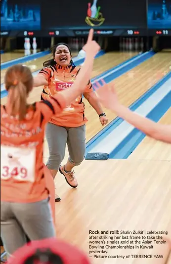  ?? — Picture courtesy of TERRENCE YAW ?? Rock and roll!: Shalin Zulkifli celebratin­g after striking her last frame to take the women’s singles gold at the Asian Tenpin Bowling Championsh­ips in Kuwait yesterday.