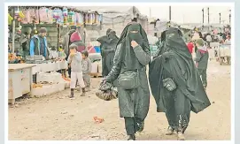  ?? Picture: AP ?? Women shop in the marketplac­e at Al-Hol camp, home to families of Islamic State fighters, in Hasakeh province, Syria.