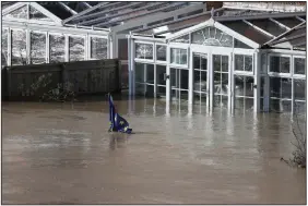  ?? (AP/PA/Steve Parsons) ?? A European Union flag is nearly covered by water Monday in Hereford, England, in the aftermath of Storm Dennis. More photos at arkansason­line.com/218uk/.