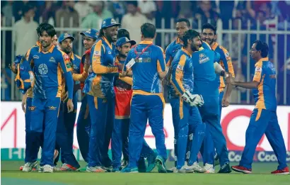  ?? Photo by M. Sajjad ?? Karachi Kings players celebrate their win against Islamabad United at the Sharjah Stadium on Wednesday night. —