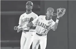  ?? GARY COSBY JR./TUSCALOOSA NEWS ?? Alabama shortstop Justin Lebron settles under a fly ball against Tennessee on March 15.