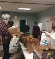  ?? PHOTO PROVIDED ?? Hope 7Food Pantry was busy Tuesday morning with people volunteeri­ng for Thanksgivi­ng donations.