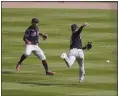  ?? CARLOS OSORIO — THE ASSOCIATED PRESS ?? Indians shortstop Andres Gimenez, right, misplays a run-scoring single during the seventh inning April 3 in Detroit.