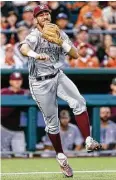  ?? Andy Nietupski / Austin American-Statesman ?? Third baseman Jorge Gutierrez makes an errant throw for one of A&M’s four errors Tuesday night.