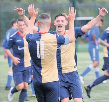  ??  ?? Happy days Kilby defender Craig Howie is all smiles as he celebrates his goal with Liam Craig (11), who provided the assist from a corner kick