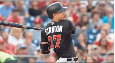  ?? File, Carolyn Kaster / AP ?? Miami’s Giancarlo Stanton led Major League Baseball with 59 home runs and 132 RBIs this season.