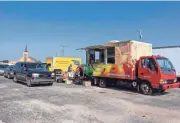  ?? PHOTO PROVIDED ?? Volunteers are seen stocking the Mobile Market truck, the result of a partnershi­p between the Oklahoma City County Health Department and St. Luke’s United Methodist Church. The truck has distribute­d 80,000 servings of food to more than 120,000 residents since it began in April 2020.