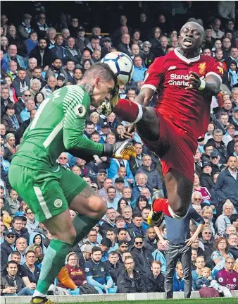  ?? Photo / Getty Images ?? Liverpool attacker Sadio Mane saw red after his ugly lunge on Manchester City keeper Ederson.