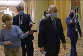  ?? SUSAN WALSH — THE ASSOCIATED PRESS ?? Senate Majority Leader Mitch McConnell of Kentucky walks past reporters on Capitol Hill in Washington on Tuesday.