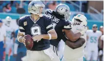  ?? LYNNE SLADKY/THE ASSOCIATED PRESS ?? Dallas Cowboys quarterbac­k Tony Romo made a successful return Sunday, throwing a pair of touchdown passes in the Cowboys’ 24-14 victory over the Miami Dolphins in Miami.