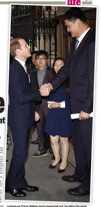  ??  ?? Looking up: Prince William meets basketball star Yao Ming this week