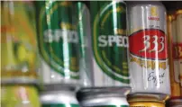  ?? (Kham/Reuters) ?? CANS OF Sabeco beer are displayed for sale in a market in Hanoi earlier this year. Thai Beverage, through a partly owned Vietnam unit, is the only company that has expressed interest in owning more than 25% of the company, which has roughly 40% of the...