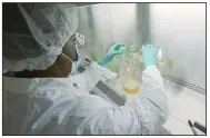  ??  ?? A researcher tests possible covid-19 antibodies in a laboratory in Indianapol­is in May. On Wednesday, pharmaceut­ical firm Eli Lilly said that partial results from testing an antibody drug in mild to moderately ill patients give hints that the drug may help avoid hospitaliz­ation. But the results have not been published or reviewed by independen­t scientists.
(AP/Eli Lilly/David Morrison)