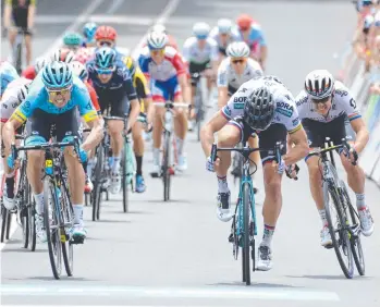  ?? Picture: AFP ?? CLOSE CALL: Bora-Hansgrohe rider Peter Sagan (second from right) wins the third stage of the Tour Down Under from Astana Pro Team rider Luis Leon Sanchez (left)