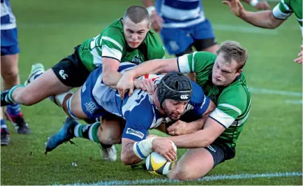  ?? ANDY JACKSON/STUFF ?? Adrian Wyrill scores the match winning try to give Tukapa their second premier club rugby title in a row.