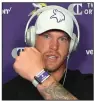  ?? (AP/Dave Campbell) ?? Minnesota Vikings tight end Kyle Rudolph displays a proximity tracking device that players and staff are wearing as part of coronaviru­s protocols.