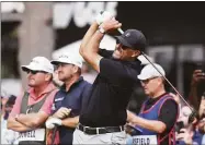  ?? Joe Lewnard / Associated Press ?? Phil Mickelson watches the flight of his tee shot on the first hole during the second round of the LIV Golf Invitation­al-Chicago on Sept. 17 in Sugar Grove, Ill.