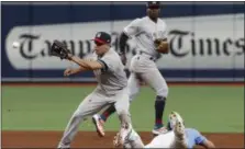  ?? SCOTT AUDETTE - THE ASSOCIATED PRESS ?? Tampa Bay Rays’ Kevin Kiermaier, right, steals second base, beating the throw to New York Yankees’ Breyvic Valera, left, during the fifth inning of a game Sunday, July 7, 2019, in St. Petersburg, Fla.